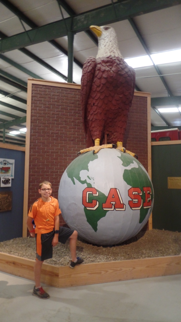 A giant statue of the case symbol of the Case tractor, large eagle standing on a globe